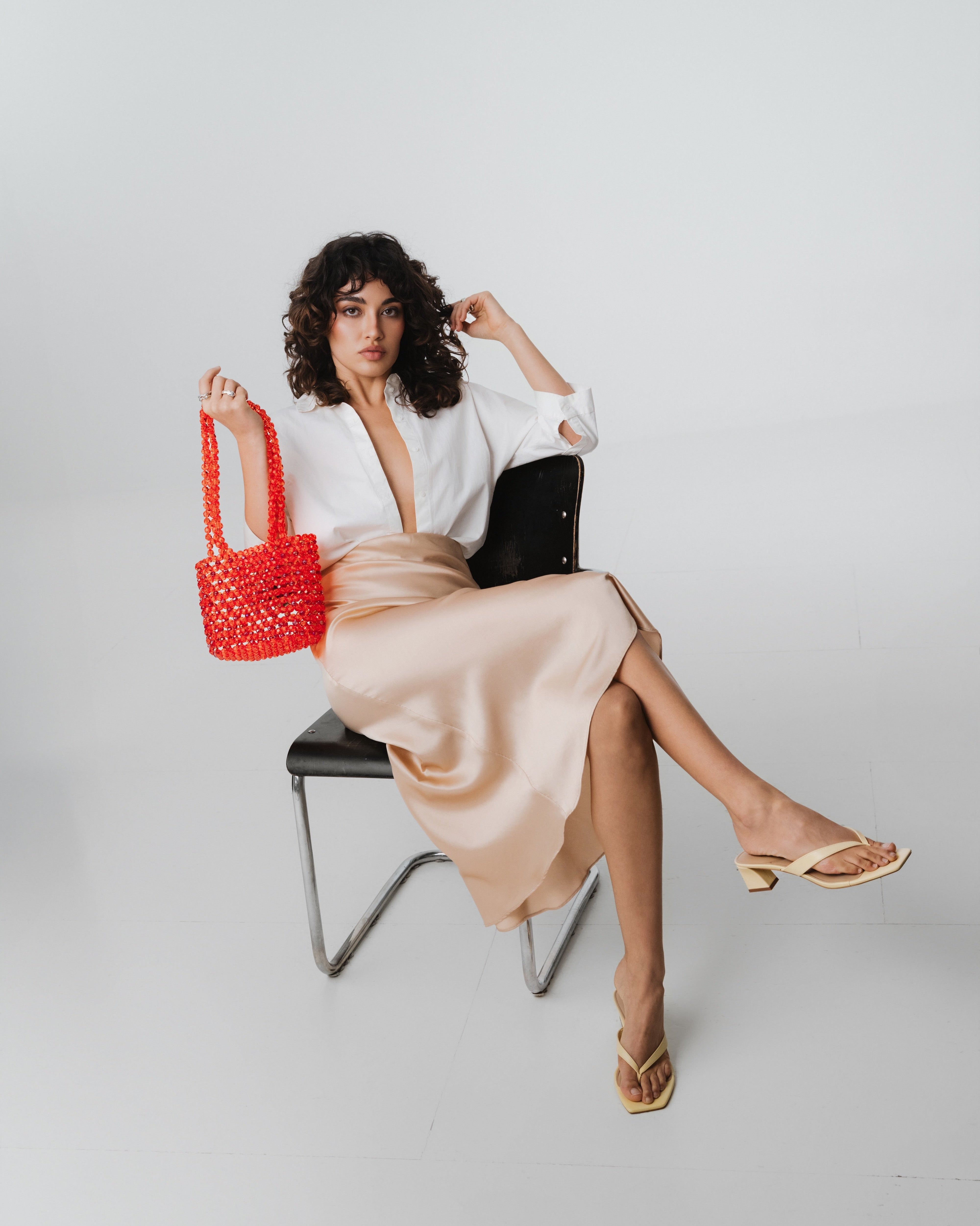 Azura glass beaded shoulder bag in red by MAREN LILIAN