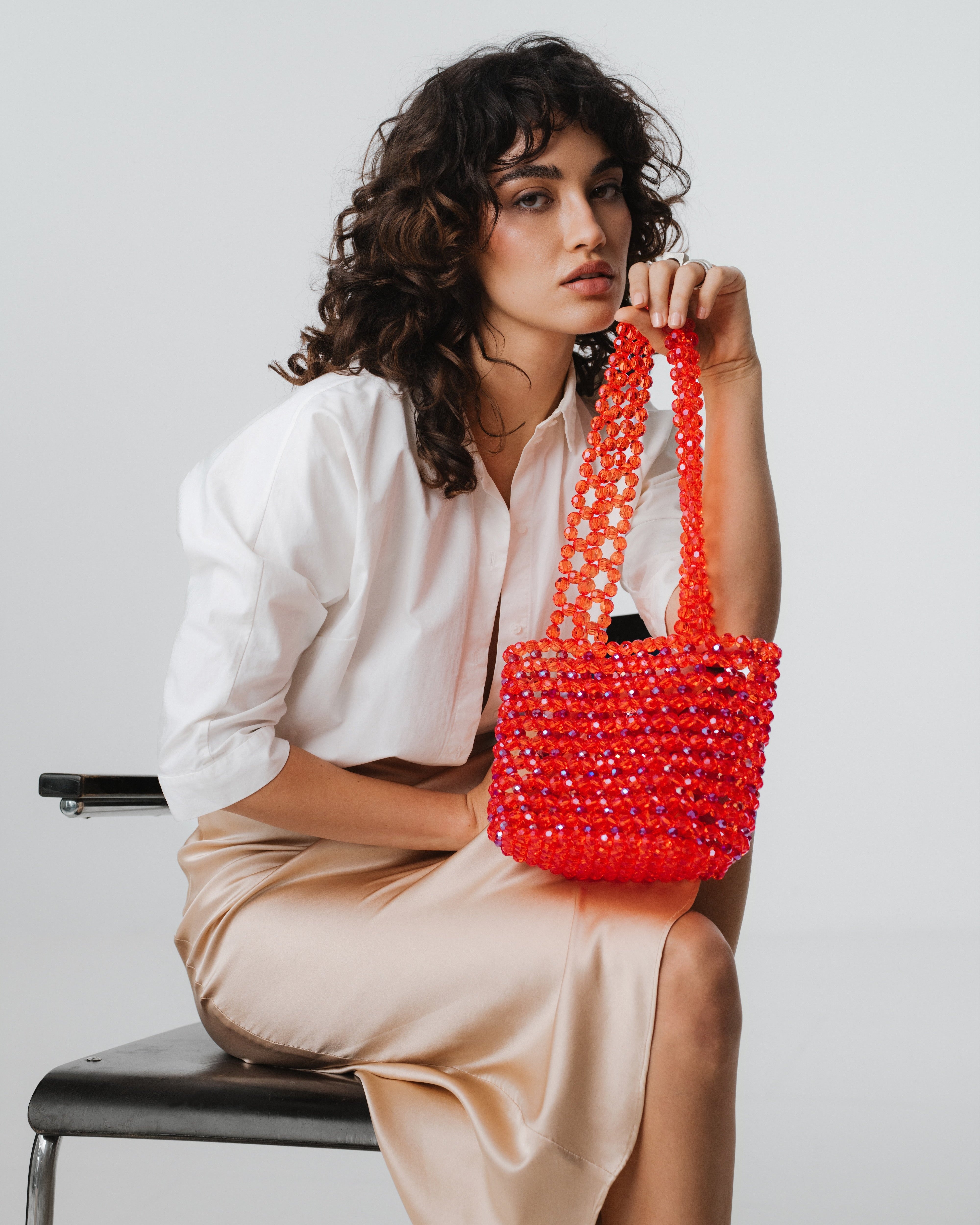 Azura glass beaded shoulder bag in red by MAREN LILIAN