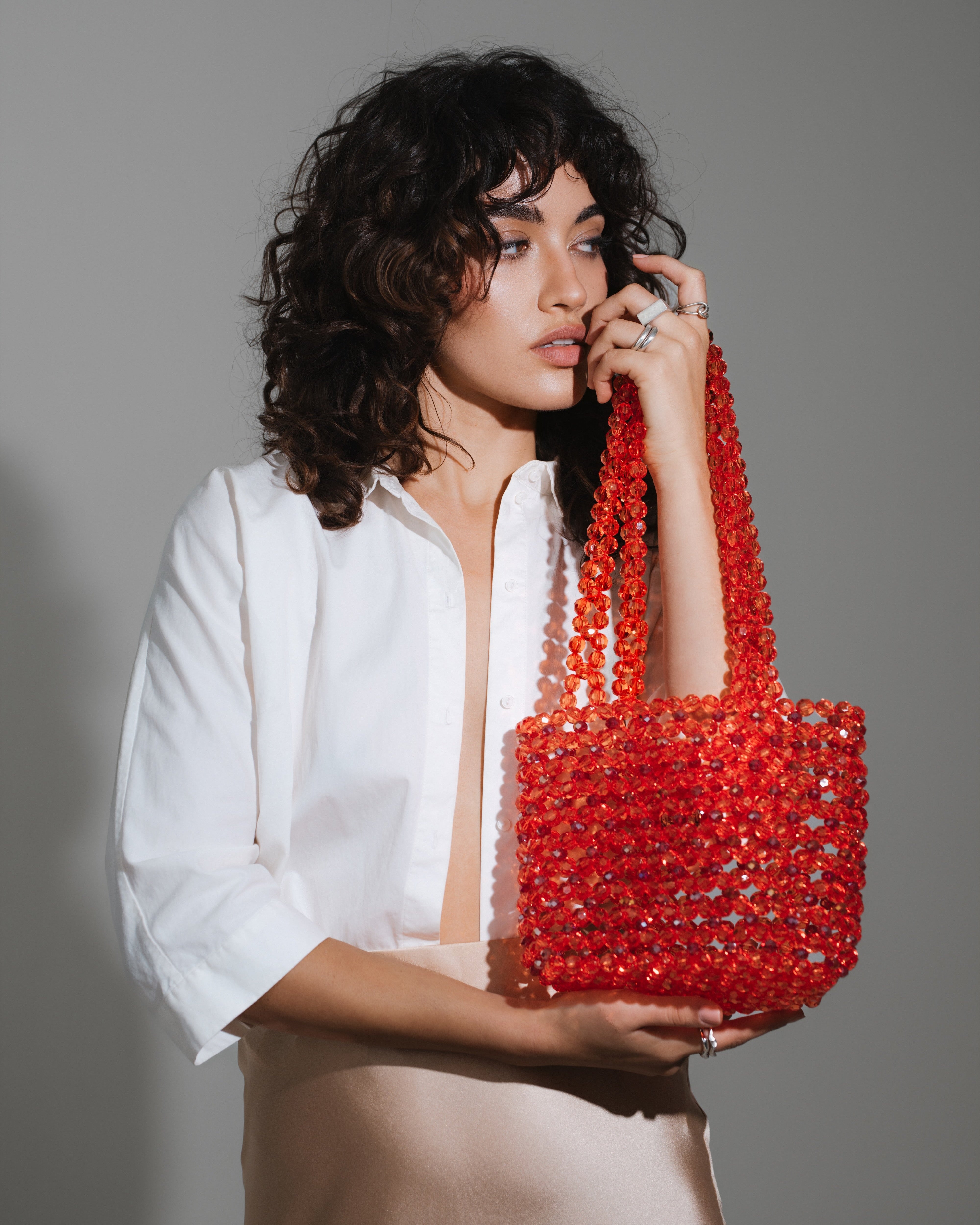 Azura glass beaded shoulder bag in red by MAREN LILIAN