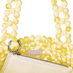 Azura glass beaded shoulder bag in yellow by MAREN LILIAN