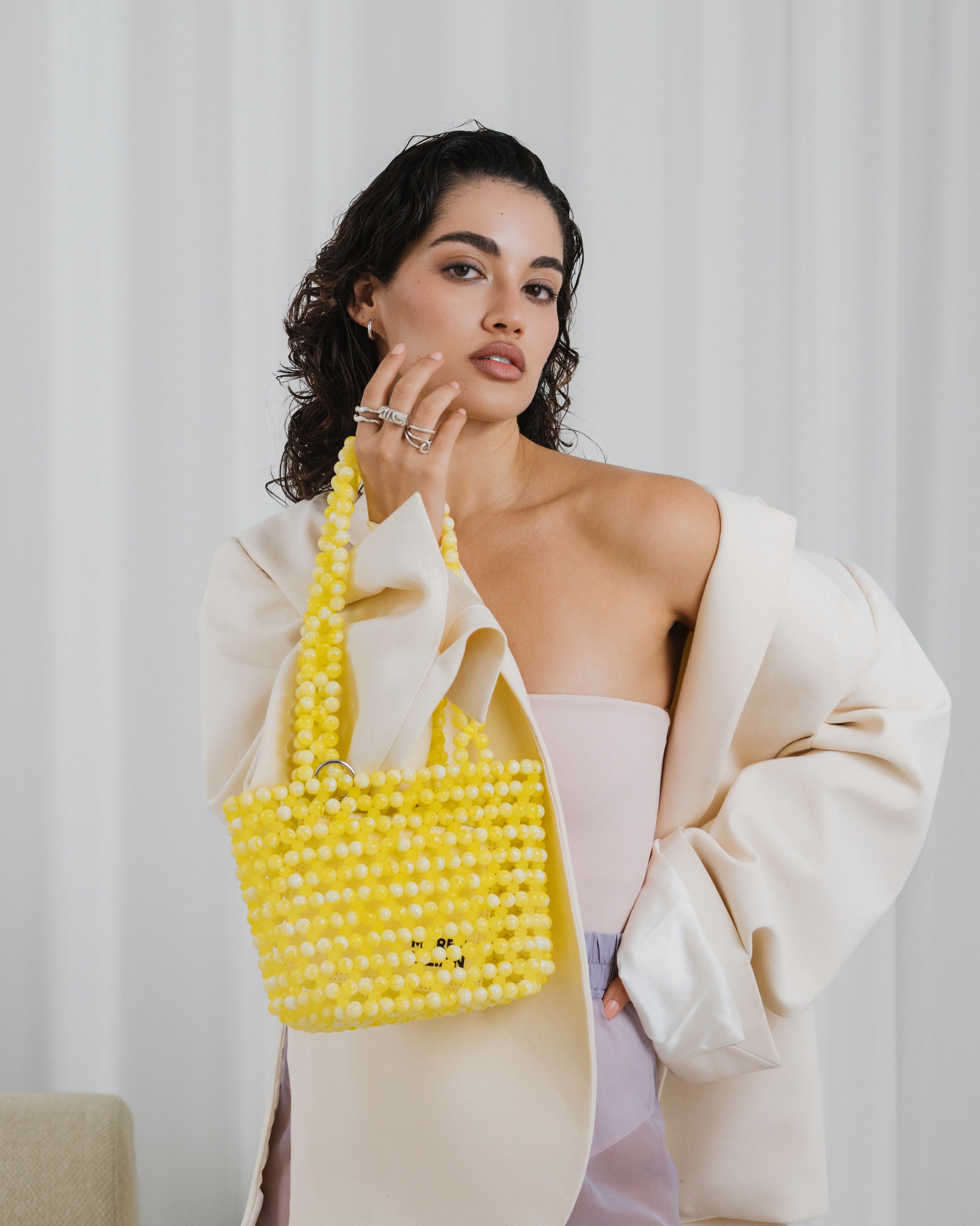 Azura glass beaded shoulder bag in yellow by MAREN LILIAN